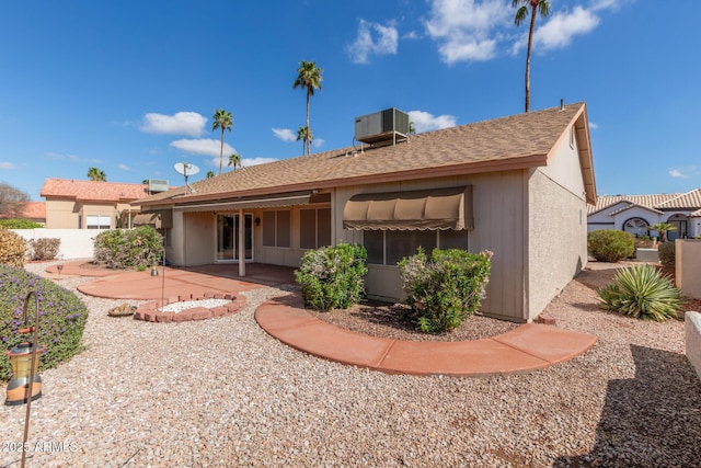 rear view of house featuring a patio and cooling unit