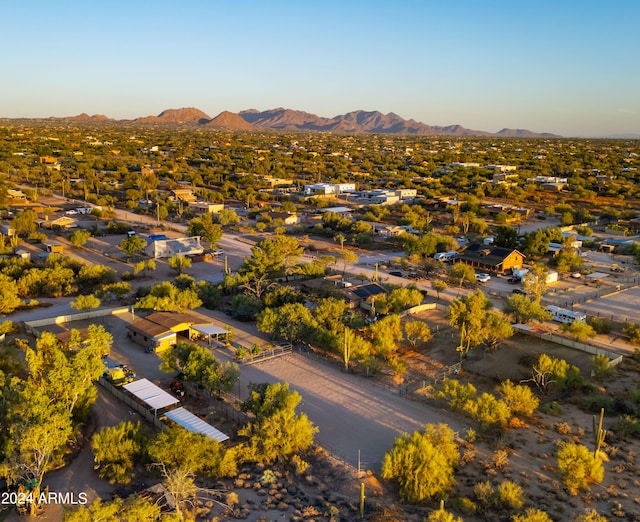 birds eye view of property with a mountain view