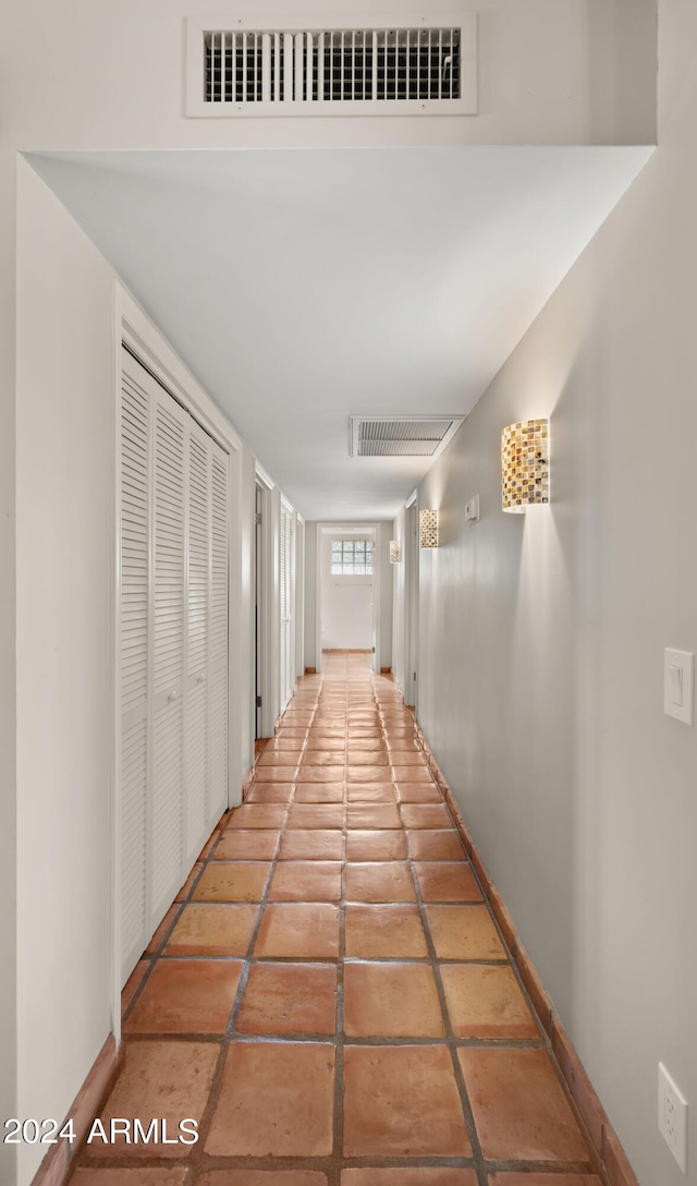 corridor featuring tile patterned flooring