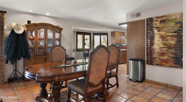 dining space with light tile patterned floors