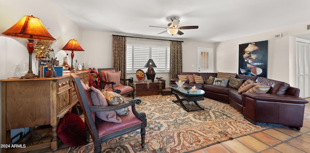 tiled living room featuring ceiling fan