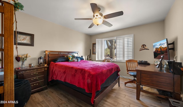 bedroom featuring ceiling fan and hardwood / wood-style flooring