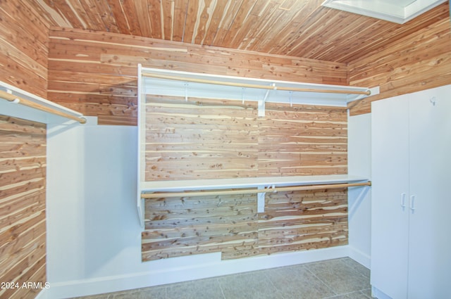 interior details featuring wood ceiling and wood walls