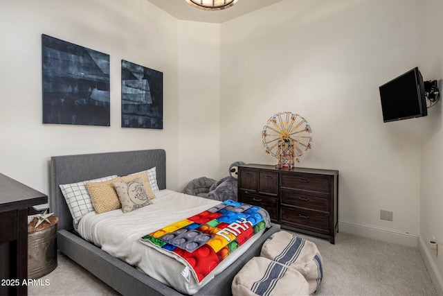 bedroom with baseboards and carpet flooring