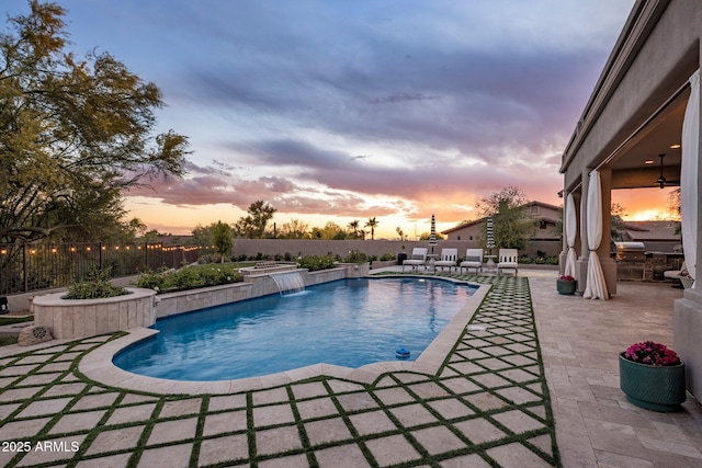 view of swimming pool featuring a fenced in pool, a fenced backyard, and a patio area