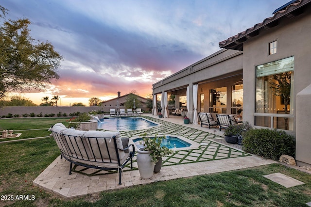 view of pool with a fenced in pool, a patio, a yard, and an outdoor living space