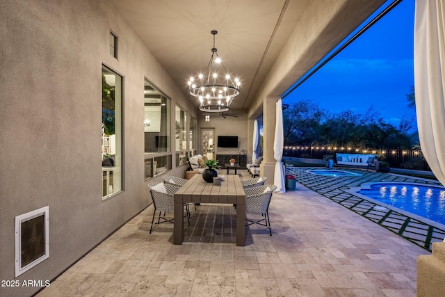 view of patio featuring a fenced in pool and outdoor dining area