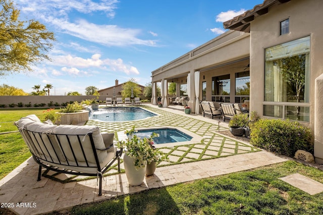 view of swimming pool with an outdoor hangout area, a fenced in pool, a lawn, and a patio area