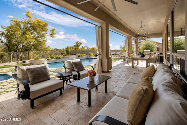 view of patio with a fenced in pool, a ceiling fan, an outdoor hangout area, and a fenced backyard