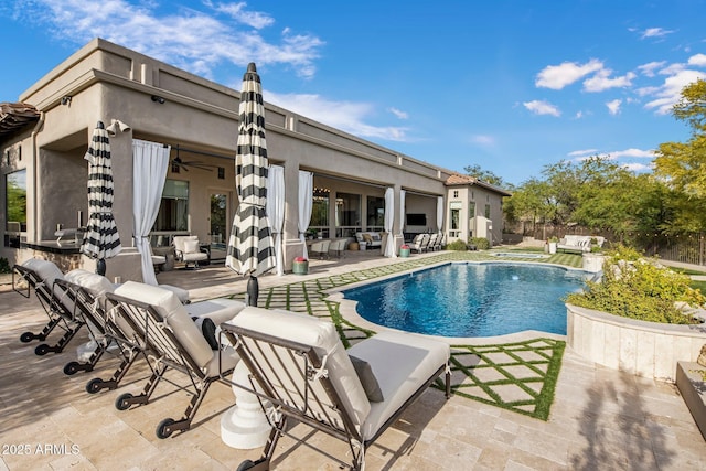 view of pool featuring an outdoor living space, a ceiling fan, a patio area, fence, and a fenced in pool
