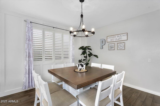 dining room with an inviting chandelier, wood finished floors, and baseboards