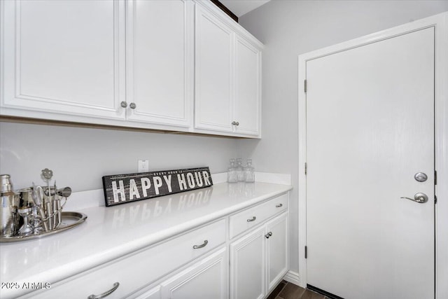 kitchen featuring white cabinetry and light countertops