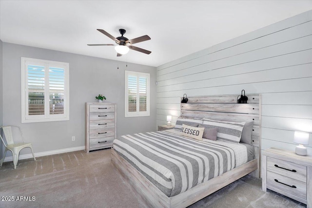 bedroom featuring ceiling fan, baseboards, and carpet