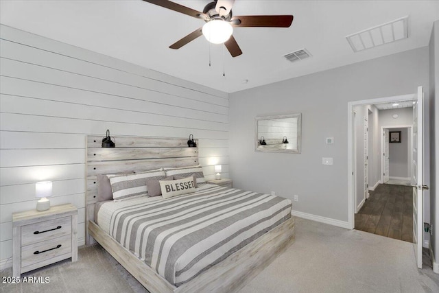 bedroom featuring carpet, baseboards, visible vents, and ceiling fan