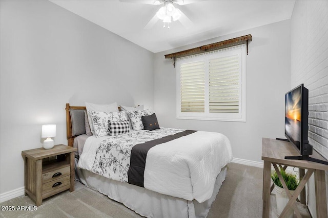 bedroom with carpet flooring, a ceiling fan, and baseboards