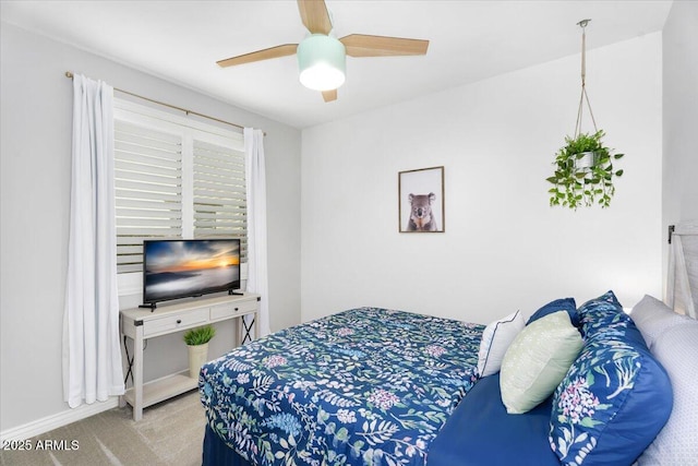 bedroom featuring carpet flooring, a ceiling fan, and baseboards