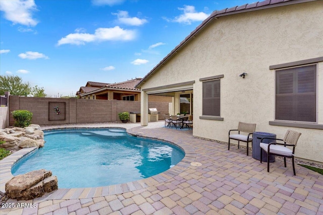 view of swimming pool with a patio, a fenced backyard, and a fenced in pool