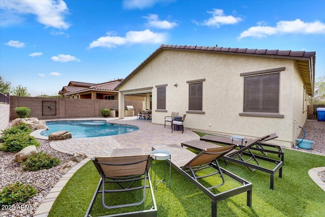 view of swimming pool with a fenced in pool, a patio, a lawn, and a fenced backyard