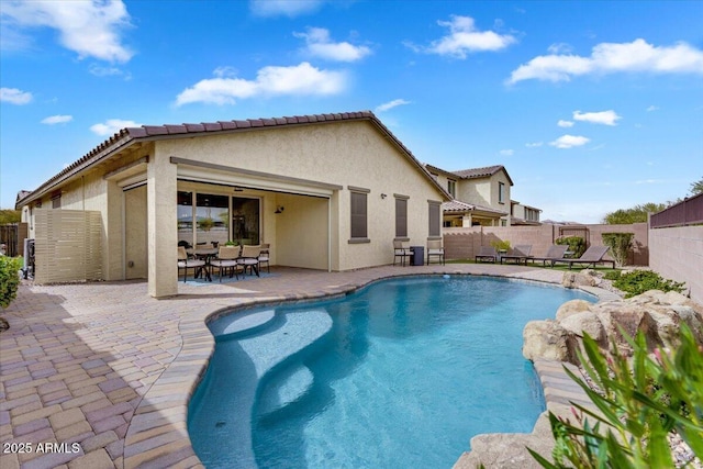 view of pool featuring a patio, a fenced backyard, and a fenced in pool