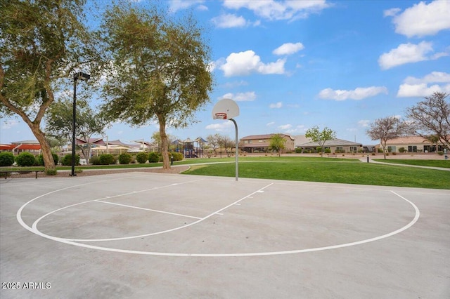 view of basketball court with community basketball court, a lawn, and a residential view