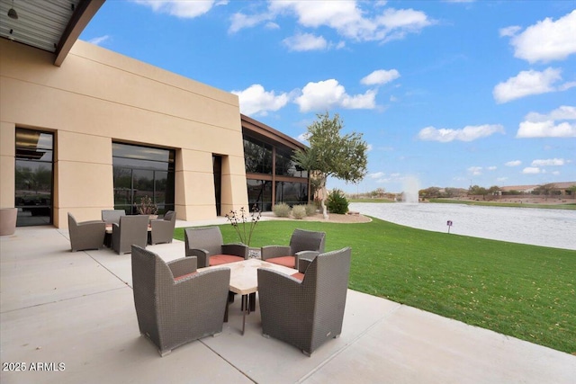 view of patio featuring a water view