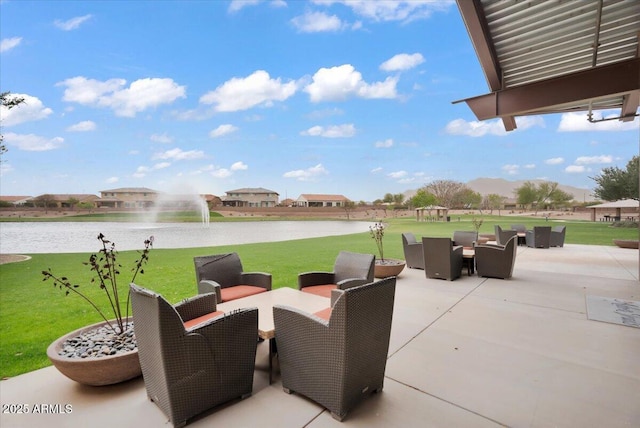 view of patio / terrace featuring outdoor dining area and a water view