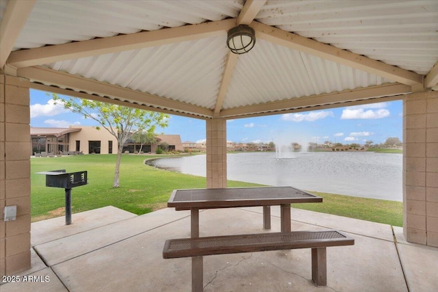 view of patio / terrace with a gazebo and a water view