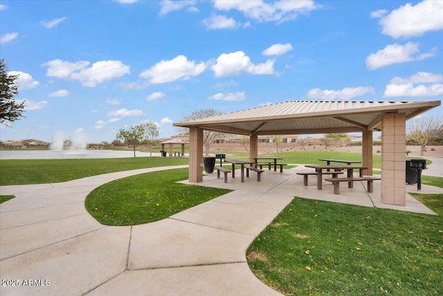 view of property's community with a gazebo and a lawn