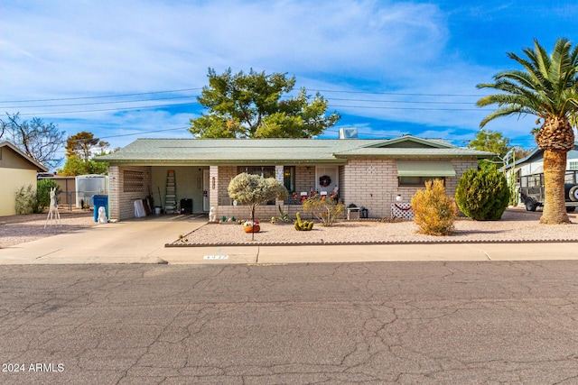 single story home with a carport