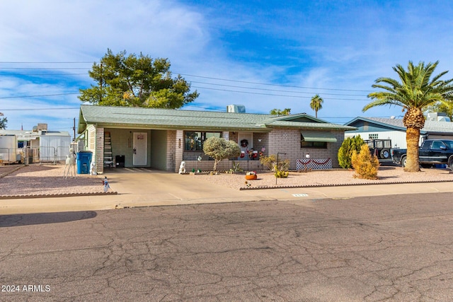 ranch-style home with a carport