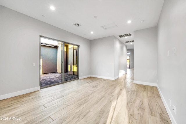 spare room with light hardwood / wood-style floors