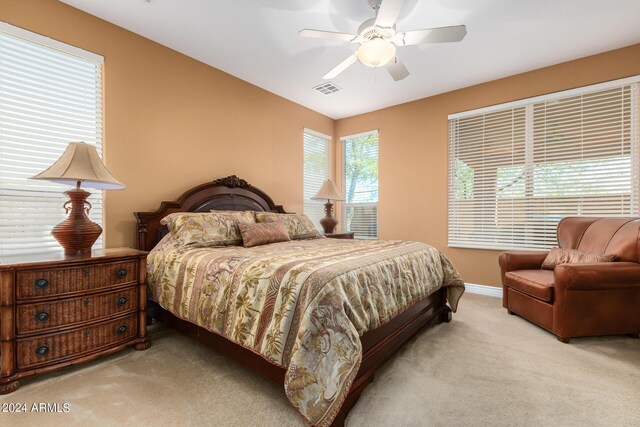 carpeted bedroom featuring ceiling fan