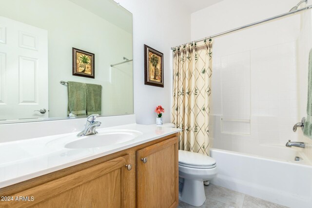 full bathroom featuring vanity, toilet, shower / bath combination with curtain, and tile patterned floors