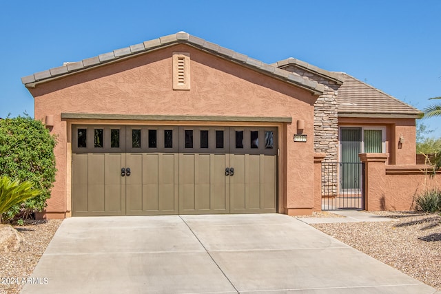 view of front of property with a garage