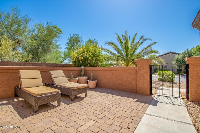 26723 N 127th Dr, Peoria, AZ 85383 - view of patio featuring a gate and fence