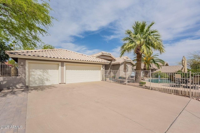 15746 E Sycamore Dr, Fountain Hills, AZ 85268 - view of front of home with concrete driveway, stucco siding, a tiled roof, and fence