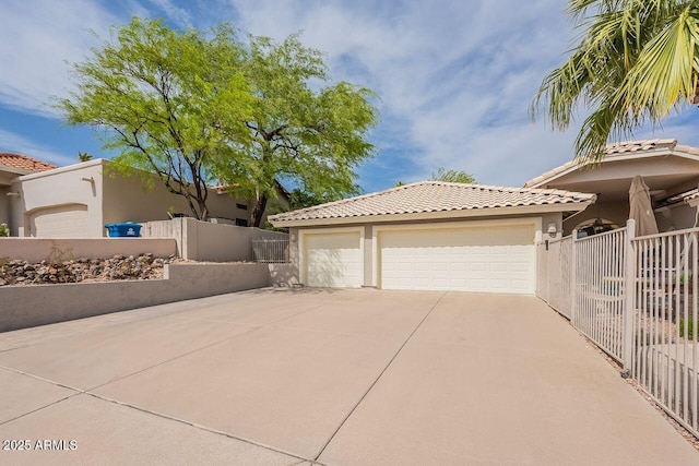 15746 E Sycamore Dr, Fountain Hills, AZ 85268 - view of side of home with a detached garage, a tiled roof, stucco siding, and fence