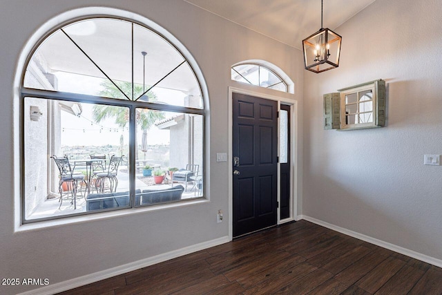 15746 E Sycamore Dr, Fountain Hills, AZ 85268 - entrance foyer with dark wood-type flooring, baseboards, and an inviting chandelier