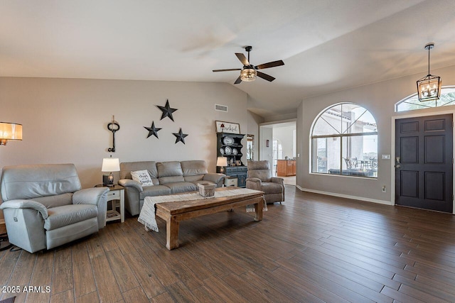 15746 E Sycamore Dr, Fountain Hills, AZ 85268 - living area featuring ceiling fan with notable chandelier, visible vents, dark wood-style flooring, lofted ceiling, and baseboards