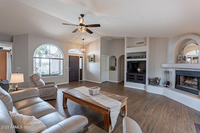15746 E Sycamore Dr, Fountain Hills, AZ 85268 - living room featuring visible vents, ceiling fan, arched walkways, and dark wood finished floors