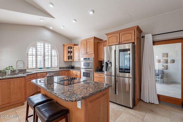 15746 E Sycamore Dr, Fountain Hills, AZ 85268 - kitchen with a center island, appliances with stainless steel finishes, dark stone countertops, a sink, and lofted ceiling