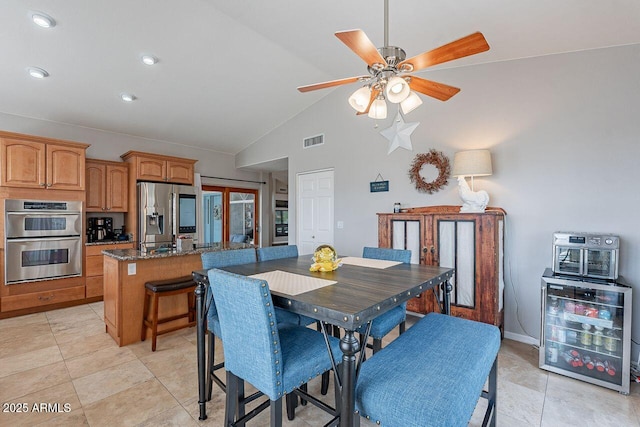 15746 E Sycamore Dr, Fountain Hills, AZ 85268 - dining space featuring visible vents, light tile patterned floors, ceiling fan, french doors, and high vaulted ceiling