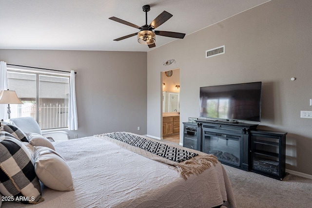 15746 E Sycamore Dr, Fountain Hills, AZ 85268 - bedroom featuring visible vents, multiple windows, vaulted ceiling, and light carpet