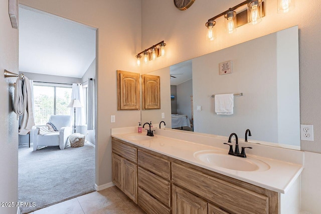 15746 E Sycamore Dr, Fountain Hills, AZ 85268 - ensuite bathroom featuring tile patterned floors, double vanity, a sink, and connected bathroom