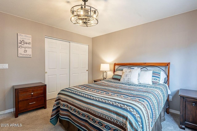 15746 E Sycamore Dr, Fountain Hills, AZ 85268 - bedroom featuring a chandelier, a closet, baseboards, and carpet floors