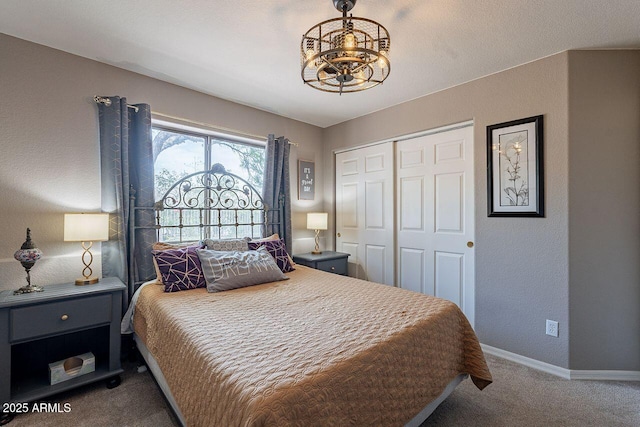 15746 E Sycamore Dr, Fountain Hills, AZ 85268 - bedroom with baseboards, a closet, a notable chandelier, and carpet