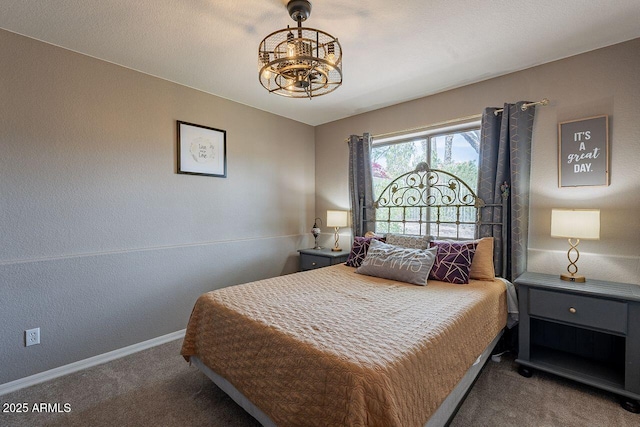 15746 E Sycamore Dr, Fountain Hills, AZ 85268 - bedroom featuring a chandelier, carpet, baseboards, and a textured wall