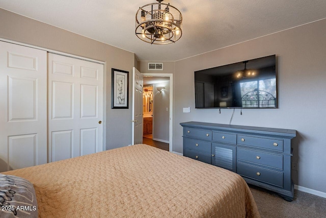 15746 E Sycamore Dr, Fountain Hills, AZ 85268 - bedroom with baseboards, a closet, a chandelier, visible vents, and dark carpet