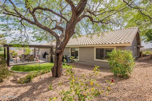 15746 E Sycamore Dr, Fountain Hills, AZ 85268 - rear view of property with central AC, a pergola, a tiled roof, a patio, and stucco siding