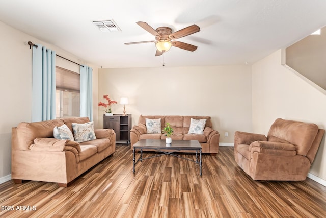 living room with ceiling fan and hardwood / wood-style floors